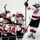New Jersey Devils' David Clarkson, center right, celebrates with teammates after scoring a goal against the New York Rangers during the third period of Game 2 of an NHL hockey Stanley Cup Eastern Conference final playoff series, Wednesday, May 16, 2012, at New York's Madison Square Garden. (AP Photo/Julio Cortez)