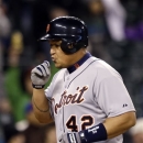 Detroit Tigers' Miguel Cabrera kisses his hand as he heads home on his two-run home run against the Seattle Mariners in the fourth inning of a baseball game Tuesday, April 16, 2013, in Seattle. (AP Photo/Elaine Thompson)