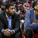 Cleveland Cavaliers' Kyrie Irving watches an NBA basketball game against the Chicago Bulls, Tuesday, Feb. 26, 2013, in Chicago. Irving sat the game out to rest his sore right knee. (AP Photo/Charles Cherney)