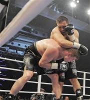 Alexander Povetkin of Russia, left, struggles under Ruslan Chagaev of Uzbekistan, right, during the WBA heavyweight title bout in Erfurt, central Germany, on Saturday, Aug. 27, 1011. Povetkin won the fight.