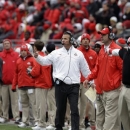 FILE -In this Nov. 24, 2012 file photo, Ohio State head coach Urban Meyer signaling from the sidelines during an NCAA college football game against Michigan in Columbus, Ohio. Coming off a 12-0 season, Ohio State opens spring practice on Tuesday, March 5, 2013. (AP Photo/Mark Duncan, File)