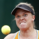 Melanie Oudin, of the U.S, eyes the ball as she plays China's Zheng Jie during their second round match of the French Open tennis tournament at the Roland Garros stadium Thursday, May 30, 2013 in Paris. (AP Photo/Petr David Josek)