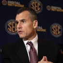 Florida NCAA college basketball coach Billy Donovan talks with reporters during the 2012 Southeastern Conference Basketball Media day in Hoover, Ala., Thursday, Oct. 25, 2012. (AP Photo/Dave Martin)