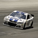 Jimmie Johnson cruises out of Turn 3 well in front of the rest of the field in the NASCAR Sprint Cup auto race at Kentucky Speedway in Sparta, Ky., Sunday, June 30, 2013. (AP Photo/Garry Jones)