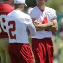 San Francisco 49ers punter Andy Lee (4) smiles at teammates during NFL football practice at the team's training facility in Santa Clara, Calif., Wednesday, May 23, 2012. Lee received a six year contract with the 49ers on Wednesday. (AP Photo/Paul Sakuma)
