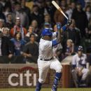 Chicago Cubs' Alfonso Soriano follows through on a hit in the 10th inning, driving in Tony Campana for the winning run as the Cubs beat the St. Louis Cardinals 3-2 in a baseball game in Chicago on Tuesday, April 24, 2012. (AP Photo/Charles Cherney)