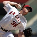 Los Angeles Angels starter Jered Weaver pitches to the Oakland Athletics in the second inning of a baseball game in Anaheim, Calif., Thursday, Sept. 13, 2012. (AP Photo/Reed Saxon)