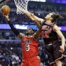 Miami Heat forward LeBron James (6) drives to the basket against Chicago Bulls center Joakim Noah during the first half of an NBA basketball game in Chicago, Thursday, Feb. 21, 2013. (AP Photo/Nam Y. Huh)