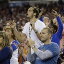 Chicago Bulls' Joakim Noah and former Florida basketball player watches action during the first half of a regional semifinal game against Florida Gulf Coast in the NCAA college basketball tournament, Friday, March 29, 2013, in Arlington, Texas. (AP Photo/Tony Gutierrez)