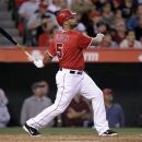 Los Angeles Angels' Albert Pujols watches the flight of his two-run home run in the third inning of a baseball game against the New York Yankees in Anaheim, Calif., Tuesday, May 29, 2012. (AP Photo/Jae C Hong)