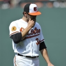 Baltimore Oriole's starting pitcher Jake Arrieta walks off the field after being pulled in the fifth inning of a baseball game against the Los Angeles Dodgers Sunday, April 21, 2013 in Baltimore. The Dodgers won 7-4. (AP Photo/Gail Burton)