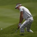 Ian Poulter of England plays a shot during the World Match Play Golf Championship tournament against John Senden of Australia in Casares, southern Spain, Thursday, May 17, 2012.(AP Photo/Sergio Torres)