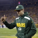 Green Bay Packers' Aaron Rodgers gives a thumbs up to fans as he walks back onto the field during the second half of an NFL football game against the Chicago Bears Monday, Nov. 4, 2013, in Green Bay, Wis. Rodgers left the game in the first half after being sacked by Shea McClellin. (AP Photo/Jeffrey Phelps)