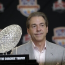 FILE -In a Jan. 8, 2013 file photo Alabama head coach Nick Saban poses with The Coaches' Trophy during a BCS National Championship college football game news conference in Ft. Lauderdale, Fla. By the time Dylan Moses is old enough to play football at Alabama, Nick Saban would be 65 and starting his 11th season at Tuscaloosa. (AP Photo/Morry Gash)
