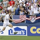 FILE - In July 4, 2009 file photo, United States' Robbie Rogers kicks against Grenada in a CONCACAF Gold Cup match at Qwest Field in Seattle. Rogers is eligible to make his debut with the Los Angeles Galaxy after Major League Soccer said it had received his international transfer certificate. The former U.S. national team winger will become the first openly gay male athlete to compete in a North American professional team sport when he makes his debut for the Galaxy, which could come in Sunday night's, May 26, 2013, game against Seattle. (AP Photo/Ted S. Warren, File)