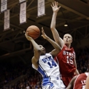 Duke's Rasheed Sulaimon (14) drives to the basket against North Carolina State's Scott Wood (15) during the first half of an NCAA college basketball game in Durham, N.C., Thursday, Feb. 7, 2013. (AP Photo/Gerry Broome)