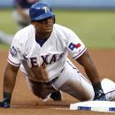 Texas Rangers' Adrian Beltre slides in safely into third on his run-scoring triple off of Minnesota Twins starting pitcher Samuel Deduno in the first inning of a baseball game Friday, Aug. 24, 2012, in Arlington, Texas. (AP Photo/Tony Gutierrez)
