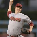 Arizona Diamondbacks starting pitcher Trevor Cahill throws to the plate during the first inning of their baseball game against the Los Angeles Dodgers, Friday, Aug. 31, 2012, in Los Angeles. (AP Photo/Mark J. Terrill)