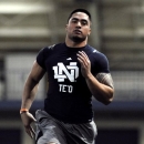 FILE - In this March 26, 2013, file photo, linebacker Manti Te'o runs the 40 yard sprint during Notre Dame's NFL football pro day in South Bend, Ind.  Some analysts have Notre Dame's All-American linebacker Mante Te'o back to being a first-round cinch, even after a great season was marred by a poor game against Alabama followed by the hoax involving a deceased 