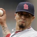 St. Louis Cardinals pitcher Kyle Lohse throws in the first inning of a baseball game against the Pittsburgh Pirates in Pittsburgh, Sunday, April 22, 2012. (AP Photo/Gene J. Puskar)