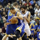 Golden State Warriors' David Lee (10) sets a pick on Minnesota Timberwolves' Ricky Rubio, right, of Spain, as Warriors' Stephen Curry drives by in the first quarter of an NBA basketball game Wednesday, Nov. 6, 2013, in Minneapolis. (AP Photo/Jim Mone)