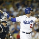Los Angeles Dodgers' Adrian Gonzalez watches the flight of his two-run home run against the San Diego Padres during the third inning of a baseball game on Friday, Aug. 30, 2013, in Los Angeles. (AP Photo/Jae C. Hong)
