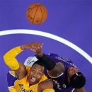 Los Angeles Lakers center Dwight Howard (12) competes for a rebound with Sacramento Kings power forward James Johnson during the first half of their preseason NBA basketball game, Sunday, Oct. 21, 2012, in Los Angeles. (AP Photo/Mark J. Terrill)