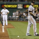 San Francisco Giants relief pitcher George Kontos, right, looks back towards home plate after being ejected for hitting Pittsburgh Pirates' Andrew McCutchen in the eighth inning of the baseball game on Tuesday, June 11, 2013, in Pittsburgh. The Pirates won 8-2. (AP Photo/Keith Srakocic)