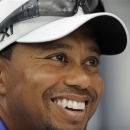 Tiger Woods reacts at a press conference at the AT&T National Golf tournament, Wednesday, July 26, 2013, in Bethesda, Md. Woods will not play in the tournament. (AP Photo/Nick Wass)