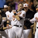 Baltimore Orioles' Matt Wieters, center, celebrates with teammates after hitting a grand slam in the tenth inning of a baseball game against the Tampa Bay Rays on Thursday, April 18, 2013, in Baltimore. Baltimore won 10-6 in ten innings. (AP Photo/Patrick Semansky)