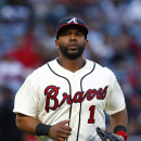 Atlanta Braves' Alberto Callaspo heads back to the dugout during the second inning of a baseball game against the Cincinnati Reds on Saturday, May 2, 2015 in Atlanta. (AP Photo/Kevin Liles)