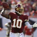 Washington Redskins quarterback Robert Griffin III (10) throws a pass against the Tampa Bay Buccaneers during the first quarter of an NFL football game Sunday, Sept. 30, 2012, in Tampa, Fla. (AP Photo/Chris O'Meara)