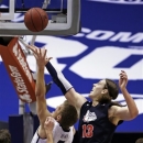 Brigham Young's Tyler Haws (3) shoots as Gonzaga's Kelly Olynyk (13) defends during the first half of an NCAA college basketball game, Thursday, Feb. 28, 2013, in Provo, Utah. (AP Photo/Rick Bowmer)
