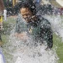 Oakland Athletics' Coco Crisp is doused at the end of their baseball game against the New York Yankees Sunday, July 22, 2012 in Oakland, Calif. Oakland won the game 5-4 to sweep their four-game series. Crisp drove in the winning run. (AP Photo/Eric Risberg)