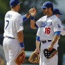 Los Angeles Dodgers first baseman James Loney, left, and right fielder Andre Ethier celebrate their 2-0 win against the Washington Nationals during a baseball game in Los Angeles, Sunday, April 29, 2012. (AP Photo/Chris Carlson)