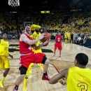 Ohio State guard Aaron Craft (4) has a layup attempt blocked by Michigan guard Tim Hardaway Jr., center back, in the final seconds of an NCAA college basketball game, Tuesday, Feb. 5, 2013, at Crisler Center in Ann Arbor, Mich. Michigan won 76-74 in overtime. (AP Photo/Tony Ding)