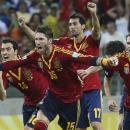 Spain's Sergio Ramos, front, and teammates Sergio Busquets, left, Juan Mata, right, and Alvaro Arbeloa , back, celebrate after defeating Italy in a penalty shootout during the soccer Confederations Cup semifinal match at Castelao stadium in Fortaleza, Brazil, Thursday, June 27, 2013. (AP Photo/Eugene Hoshiko)