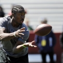 Running back Marcus Lattimore makes a catch during South Carolina's NFL football pro day on Wednesday, March 27, 2013 in Columbia, S.C. (AP Photo/Rainier Ehrhardt)