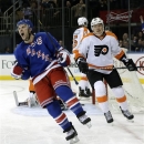 Philadelphia Flyers left wing Ruslan Fedotenko (26), of Ukraine, watches as New York Rangers right wing and captain Ryan Callahan (24) reacts after scoring a goal in the second period of their NHL hockey game at Madison Square Garden in New York, Tuesday, Jan. 29, 2013.  (AP Photo/Kathy Willens)