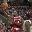 Indiana's Victor Oladipo, left, shoots over Ohio State's Evan Ravenel during the second half of an NCAA college basketball game on Sunday, Feb. 10, 2013, in Columbus, Ohio. Indiana defeated Ohio State 81-68. (AP Photo/Jay LaPrete)
