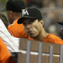 Miami Marlins hitting coach Tino Martinez looks from the dugout during a baseball game against the Pittsburgh Pirates in Miami, Sunday, July 28, 2013. Martinez has resigned after players complained he verbally abused them. (AP Photo/Alan Diaz)
