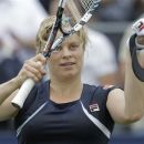 Kim Clijsters of Belgium celebrates winning her match against Francesca Schiavone of Italy at the Unicef Open grass court tennis tournament in Rosmalen, central Netherlands, Thursday, June 21, 2012. Clijsters won in two sets 6-3, 7-6. (AP Photo/Peter Dejong)