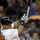 Detroit Tigers' Miguel Cabrera connects for a three-run home run during the seventh inning of a baseball game against the Atlanta Braves in Detroit, Sunday, April 28, 2013. (AP Photo/Carlos Osorio)