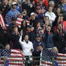Fans cheer on the first tee during a foursomes match at the Ryder Cup PGA golf tournament Saturday, Sept. 29, 2012, at the Medinah Country Club in Medinah, Ill. (AP Photo/David J. Phillip)