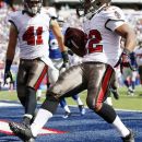 Tampa Bay Buccaneers running back Doug Martin (22) celebrates with Erik Lorig (41) after rushing for a touchdown during the first half of an NFL football game against the New York Giants, Sunday, Sept. 16, 2012, in East Rutherford, N.J. (AP Photo/Julio Cortez)