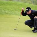 Roger Chapman eyes his putt on the fifth hole during the third round of the Senior PGA Championship golf tournament at the Harbor Shores Golf Club in Benton Harbor, Mich., Saturday, May 26, 2012. (AP Photo/Carlos Osorio)