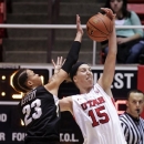 Utah forward Michelle Plouffe (15) pulls down a pass as Colorado guard Chucky Jeffery (23) defends during the first half of an NCAA college basketball game, Sunday, Jan. 13, 2013, in Salt Lake City. (AP Photo/Rick Bowmer)
