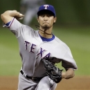 Texas Rangers' Yu Darvish delivers a pitch against the Houston Astros in the fifth inning of a baseball game Tuesday, April 2, 2013, in Houston. (AP Photo/Pat Sullivan)
