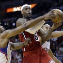 Miami Heat's LeBron James (6) is fouled as he goes to the basket by Los Angeles Clippers' DeAndre Jordan, left, during the first half of an NBA basketball game in Miami, Friday, Feb. 8, 2013. (AP Photo/Alan Diaz)
