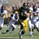 FILE - In this Sept. 22, 2012 file photo, Iowa fullback Mark Weisman runs for a 34-yard touchdown run during the first half of an NCAA college football game against Central Michigan, in Iowa City, Iowa. One of the few bright spots for Iowa last season was the emergence of Weisman, a former walk-on fullback who showed he could be among the Big Ten's best ball carriers _ when healthy. (AP Photo/Charlie Neibergall, File)